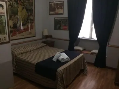 a bedroom with a bed with two towels on it at Vacanze Romane 2 in Rome
