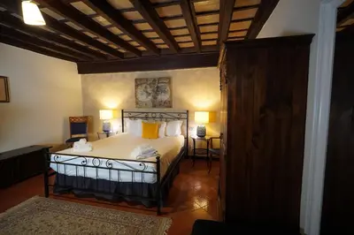 a bedroom with a large bed with yellow pillows at MGPgroup Rome Center Hot Spot in Rome