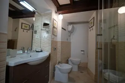 a bathroom with a sink and a toilet and a shower at MGPgroup Rome Center Hot Spot in Rome
