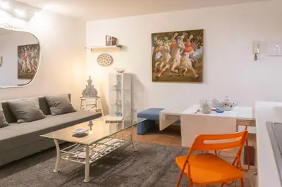 a living room with a couch and a table at My Cosy Home in Rome
