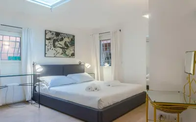 a bedroom with a bed with two towels on it at My Cosy Home in Rome