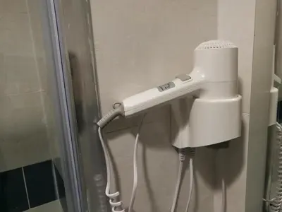 a blow dryer is attached to a wall at Al Trenino accomodation in Rome