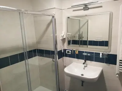 a bathroom with a sink and a shower at Al Trenino accomodation in Rome