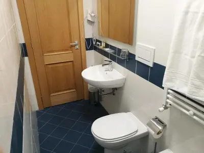 a small bathroom with a toilet and a sink at Al Trenino accomodation in Rome