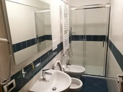 a bathroom with a sink and a toilet and a shower at Al Trenino accomodation in Rome