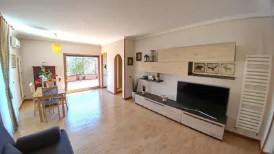 a living room with a large flat screen tv at Terrace22 - Delizioso attico ben collegato in Rome