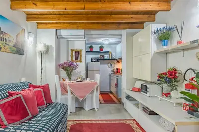 a living room with a couch and a table at Diana Romantic Loft in Rome