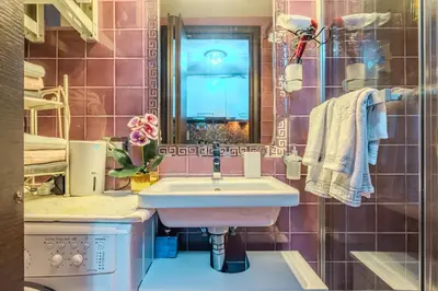 a bathroom with a sink and a mirror at Diana Romantic Loft in Rome