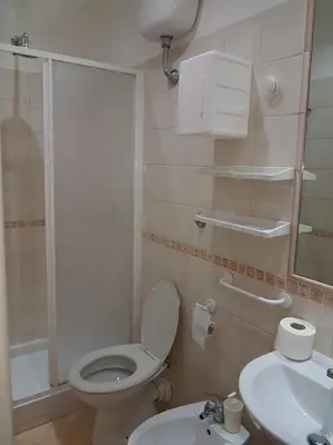 a hotel room with a bed and a bathroom at Evergreen in Rome