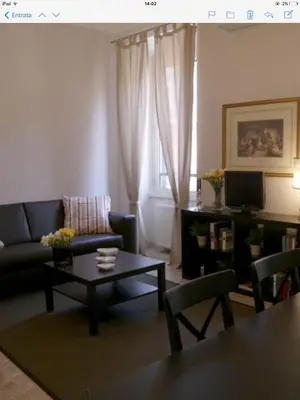 a living room with a couch and a coffee table at Vatican Attic in Rome