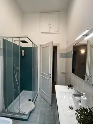 a bathroom with a shower and a sink at Vatican Attic in Rome