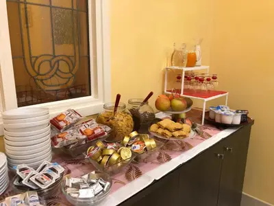 a buffet with many different types of food on a counter at Fabio dei Velapazza Guesthouse in Rome