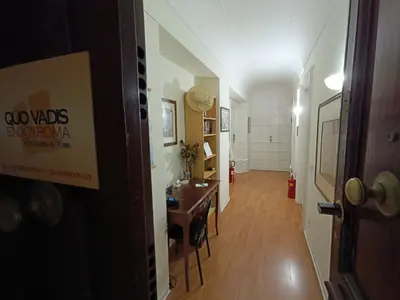 a hallway with a table and a dining room at Quo Vadis Roma 2 in Rome