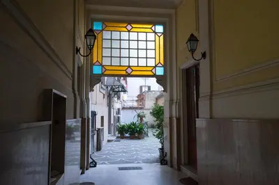 an empty hallway with a stained glass window at Quo Vadis Roma 2 in Rome