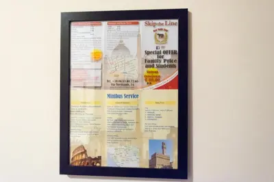 a framed poster hanging on a wall at Quo Vadis Roma 2 in Rome