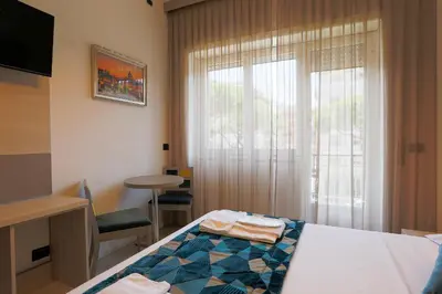 a hotel room with a bed and a window at DaVinci Relais Guest House in Rome