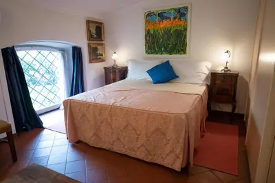 a bedroom with a bed and a window at Forum Apartment in Rome