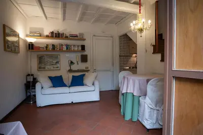 a living room with a white couch and a table at Forum Apartment in Rome