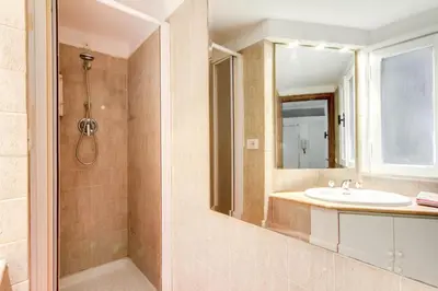 a bathroom with a sink and a mirror at Campo dei Fiori Stunning and Quiet in Rome