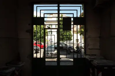 an open door with a view of a parked car at Circus Maximus Home in Rome