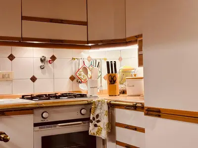 a kitchen with a stove top oven in a kitchen at Paradiso Borgia in Rome