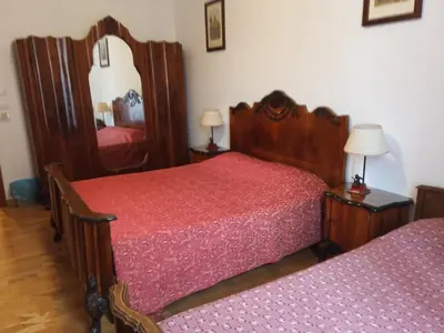 a bedroom with two beds and a mirror at ROMA CENTER, Rione Monti, Apartament in Rome