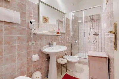 a bathroom with a sink and a toilet and a shower at ROMA CENTER, Rione Monti, Apartament in Rome