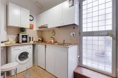 a kitchen with a sink and a washing machine at ROMA CENTER, Rione Monti, Apartament in Rome
