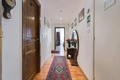 a hallway with a door and a rug on the floor at ROMA CENTER, Rione Monti, Apartament in Rome