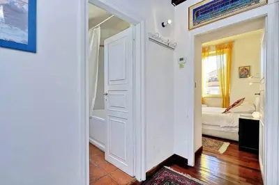 a hallway with a door leading to a bedroom at Trastevere Lovely Studio Apartment in Rome