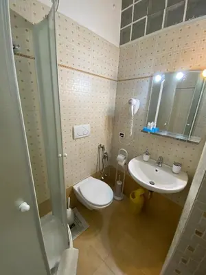 a bathroom with a shower and a toilet and a sink at tagliaferri lucia in Rome
