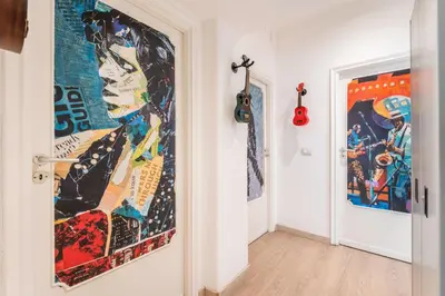a hallway with a large painting on the wall at House Of Music in Rome