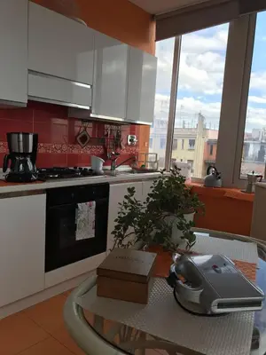 a kitchen with a table with a tea kettle on it at Domus Mirabile in Rome