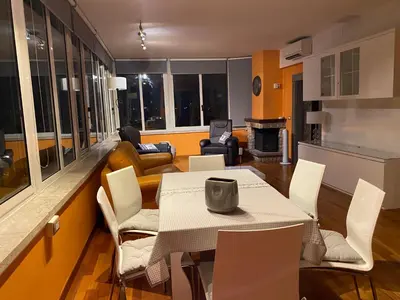 a living room with a table and chairs at Domus Mirabile in Rome