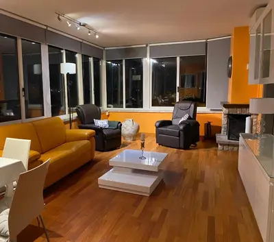 a living room with a yellow couch and chairs at Domus Mirabile in Rome