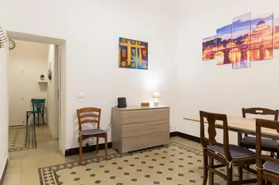 a dining room with a table and chairs and a desk at Central Apartment Navona Square in Rome