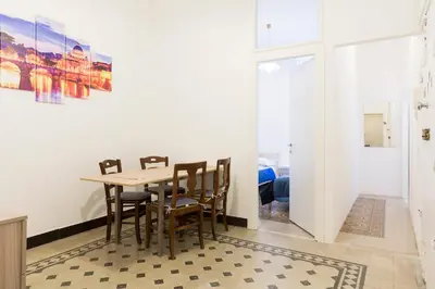 a dining room with a table and chairs at Central Apartment Navona Square in Rome