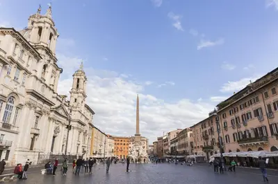 a group of people walking around a city street at Central Apartment Navona Square in Rome