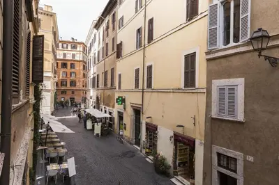 an empty street in an alley between buildings at Central Apartment Navona Square in Rome