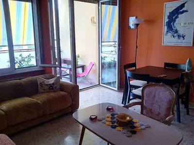 a living room with a couch and a table at 4321 B&B Stazione Trastevere in Rome