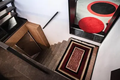 a set of stairs with a painting on the wall at Archdesign Studio in Rome