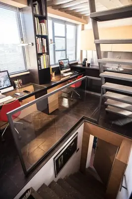 an office with a glass desk and a laptop computer at Archdesign Studio in Rome