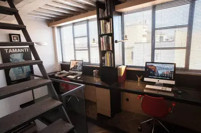 an office with a desk with a computer and a chair at Archdesign Studio in Rome