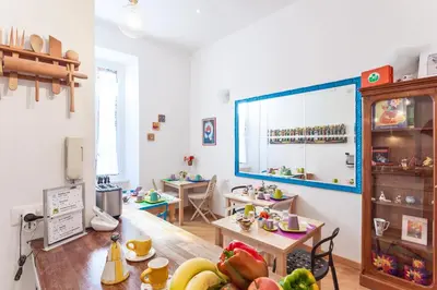 a room with a table with fruits on it at Gli Artisti Apartments Rome in Rome