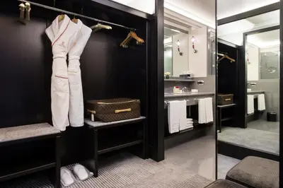 a bathroom with a walk in closet with a mirror at Hassler Roma in Rome