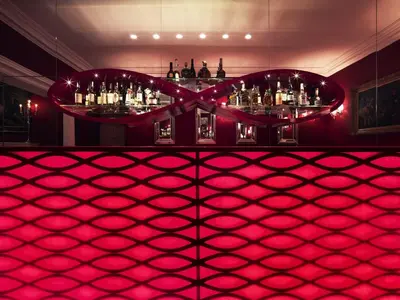a room with a bar with a pink floor at Il Palazzetto in Rome