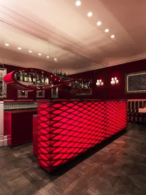 a bar with red lighting in a room at Il Palazzetto in Rome