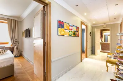 a hotel room with a door leading to a bedroom at Rooms Roma - Monti in Rome