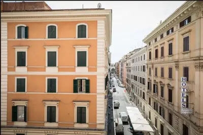 an aerial view of a city street with buildings at Alex Romano in Rome