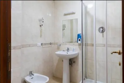 a bathroom with a sink and a shower at Alex Romano in Rome